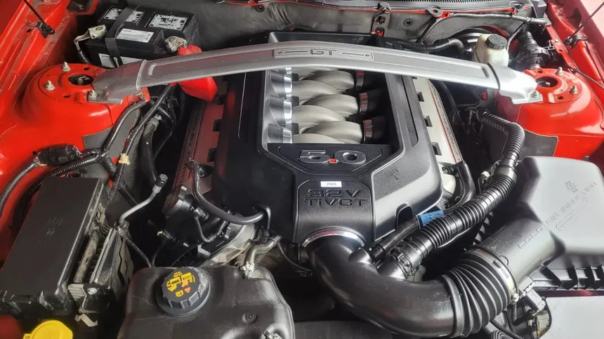 The Ford Coyote 5.0 reimagined the modern American V8. History, generations, GT350 Voodoo, and the legacy of the engine that saved the Mustang. Engine's Syndicate.