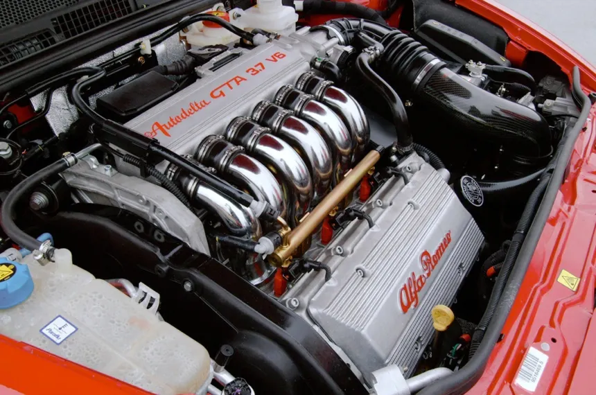 Giuseppe Busso portrait next to his legendary V6 engine design