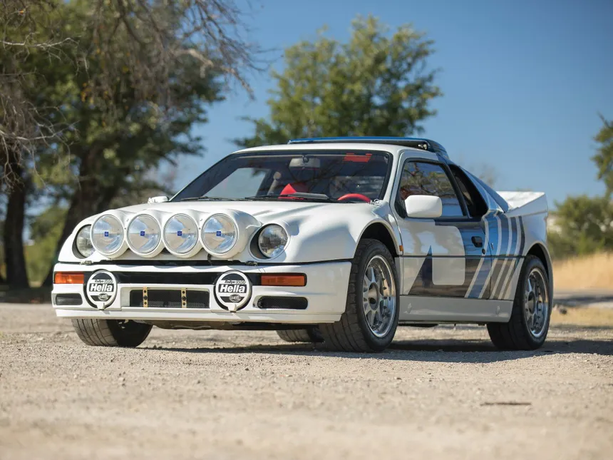 White Ford RS200 road car front three-quarter view showing Ghia-designed composite bodywork Sierra headlights and alloy wheels