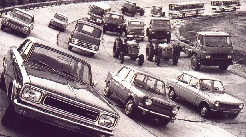 Eduardo Barreiros in a 1950s industrial workshop surrounded by diesel engines and tools, dramatic black and white lighting reflecting the determination of a mechanic fighting against the system