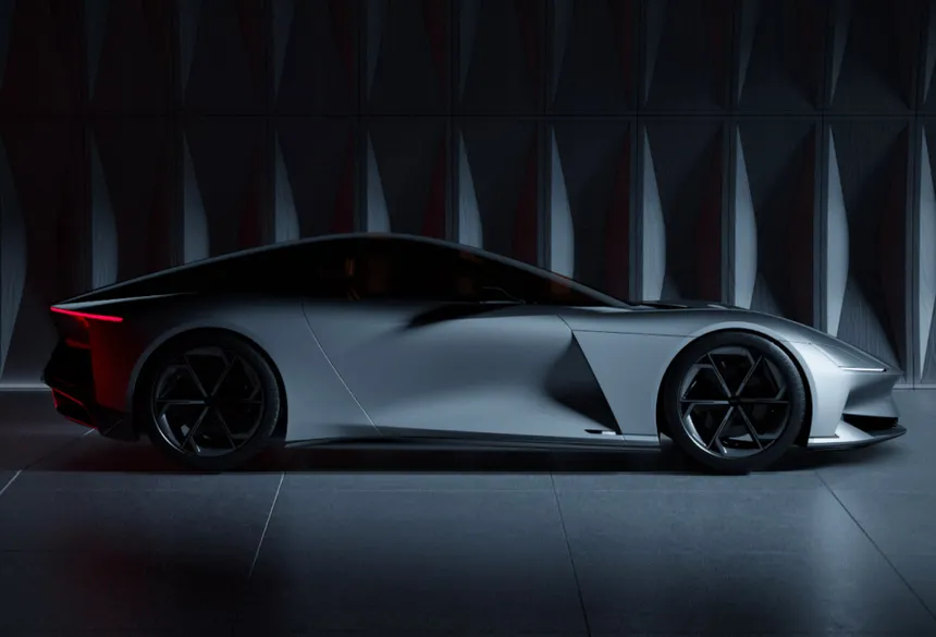 Luxury American electric coupé with flowing comet-line design parked in dramatic golden hour setting, low aggressive stance with deep metallic finish