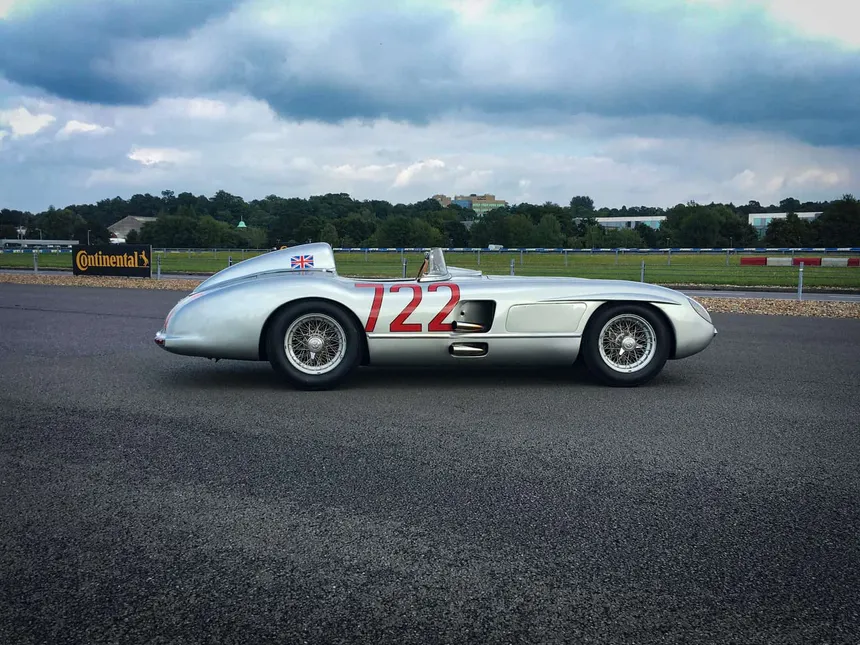 1955 Mercedes-Benz 300 SLR W196 S in silver with Mille Miglia number 722, side profile in motion