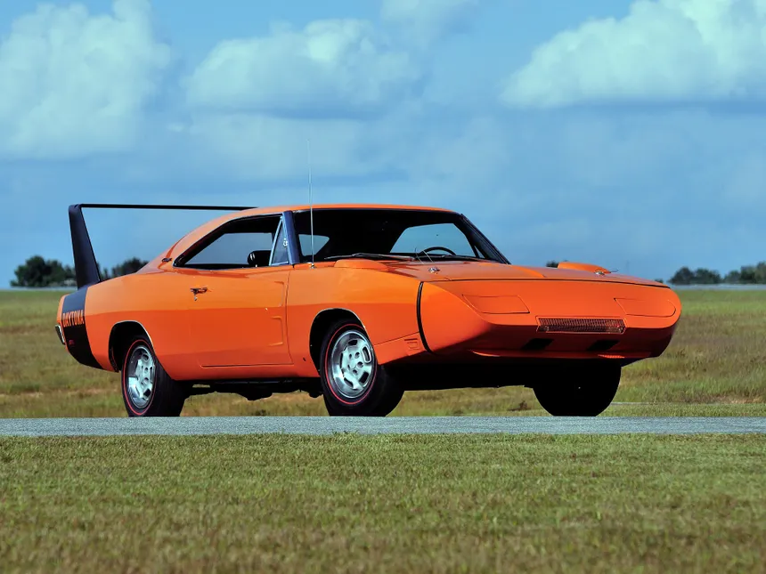 Orange 1969 Dodge Charger Daytona showing its characteristic pointed nose cone and massive rear wing