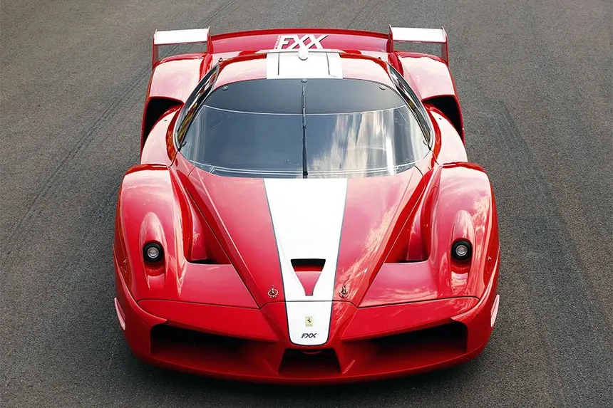 Red Rosso Corsa Ferrari FXX parked in the Maranello workshop