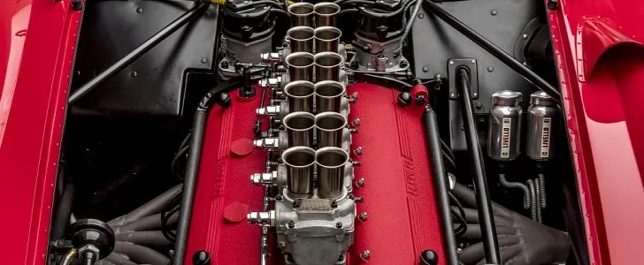 Colombo V12 engine of a classic Ferrari with its red crinkle-finish rocker covers and Weber carburettors