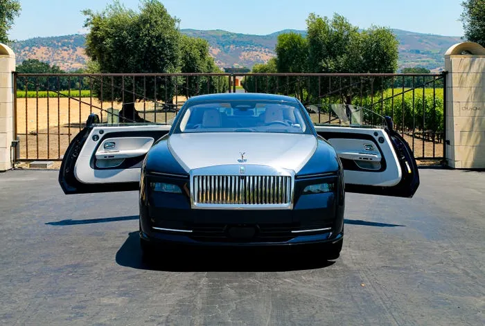 Rolls-Royce Spectre front end with the Spirit of Ecstasy and illuminated Pantheon grille