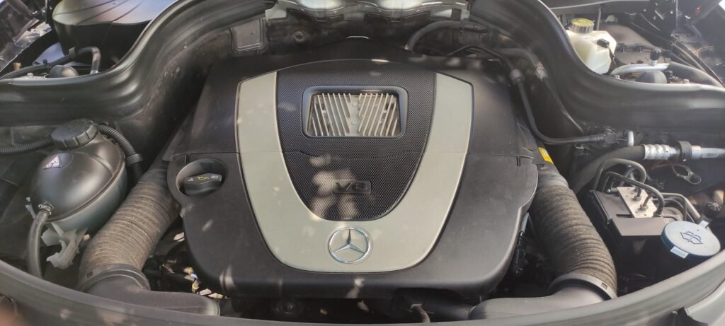 Mercedes M272 V6 under its engine cover in a GLK