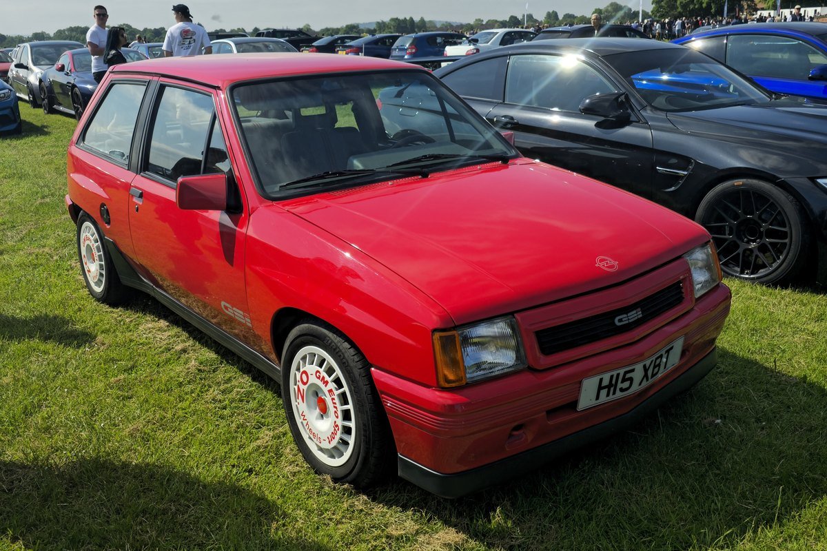 Red 1991 Opel Corsa A GSi from the front three-quarter, with the GSi script in the grille