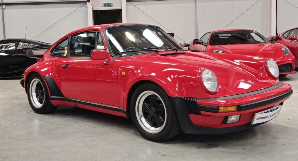 Red Porsche 911 Turbo 930 with its whale-tail rear wing