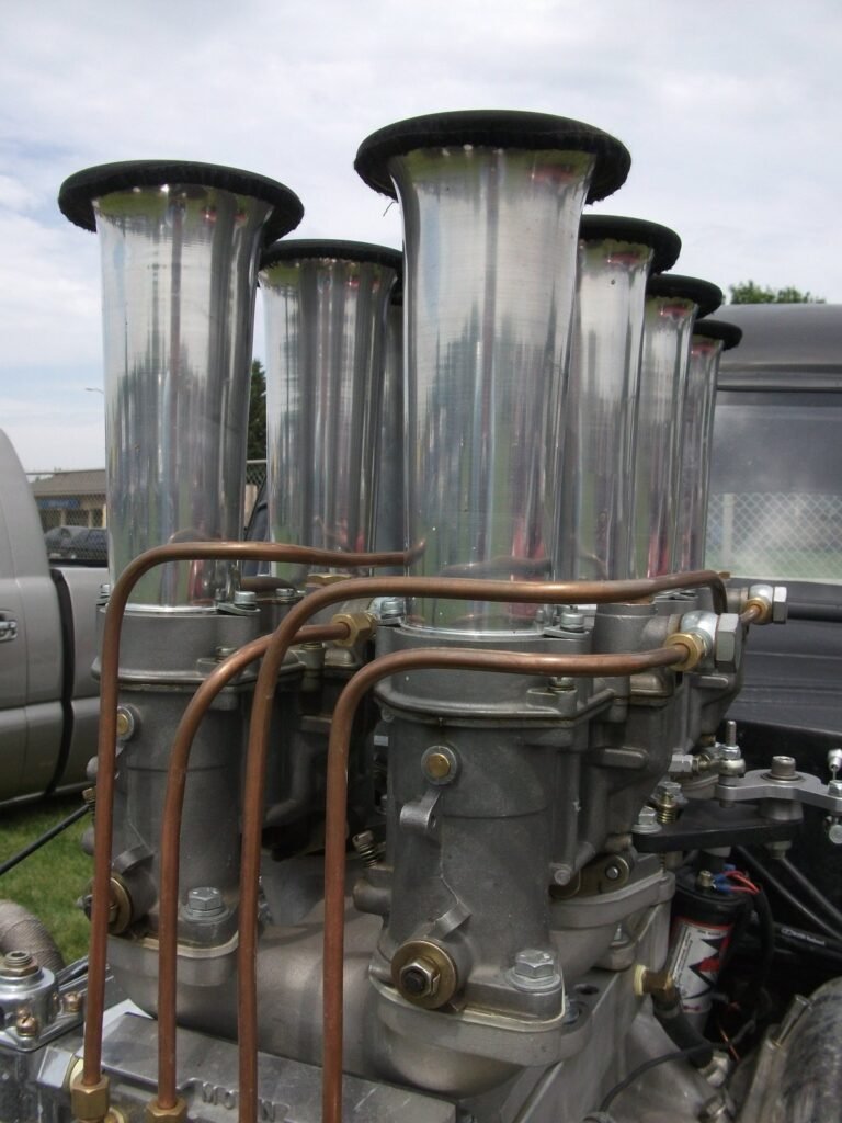 Tall velocity stacks on carburetors, one per cylinder
