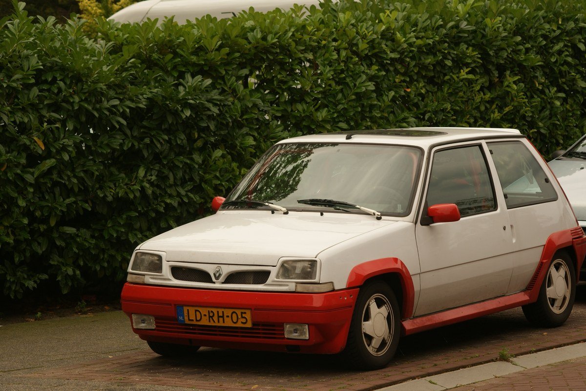 White and red 1986 Phase 1 Renault 5 GT Turbo with the diamond badge centered on the nose